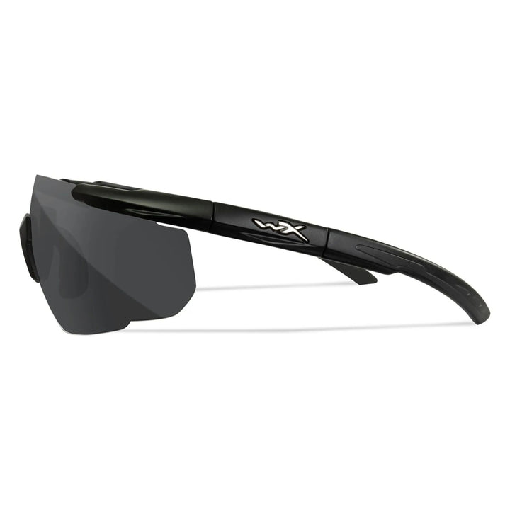 Side view of Wiley X Saber-Advanced tactical glasses with a black frame and smoke lens, ideal for outdoor and shooting sports.