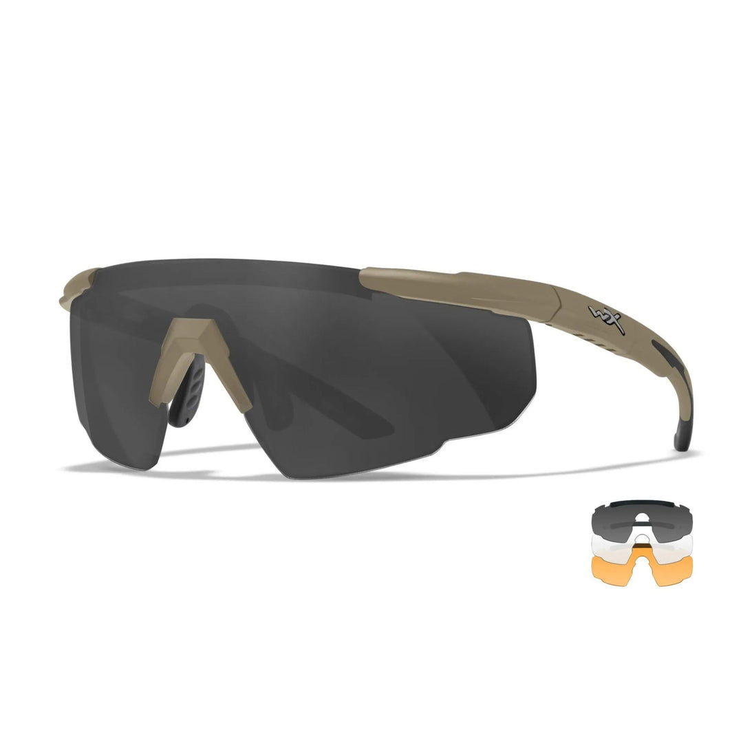 Wiley X Saber Advanced tactical sunglasses in matte tan with grey and clear lenses, shown from a side angle for a sleek and rugged design.